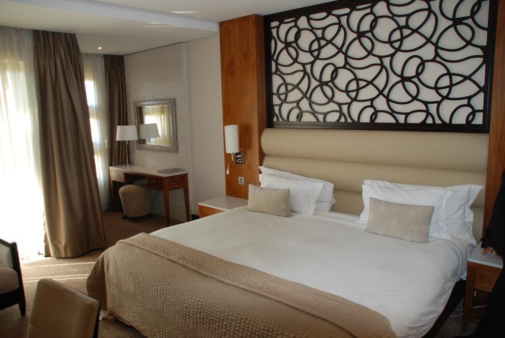 Royal Marang Hotel Phokeng Room photo A bedroom in the hotel